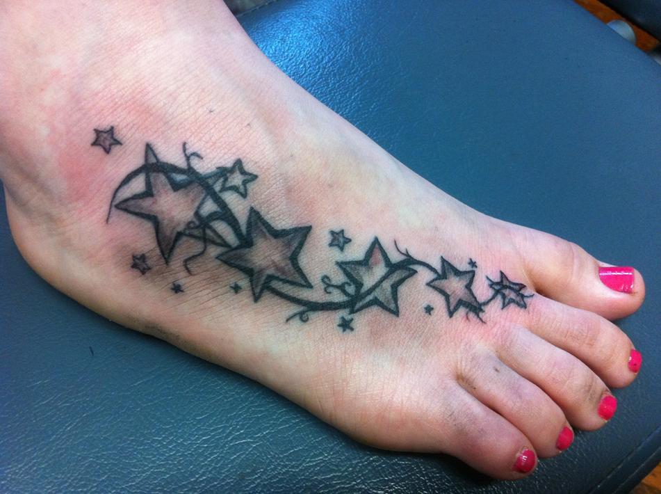 foot with star tattoos